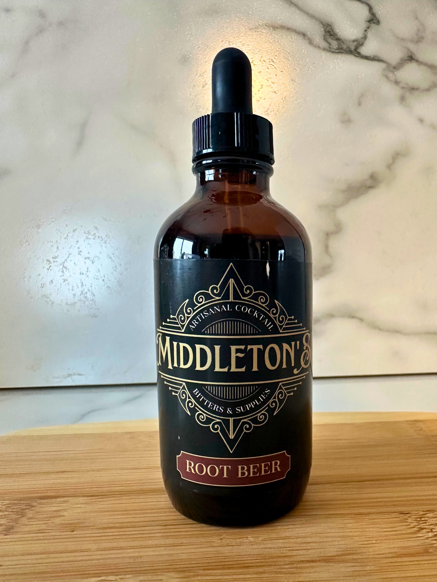 Middleton's Root Beer Bitters 4oz bottle with rich amber liquid and handcrafted label