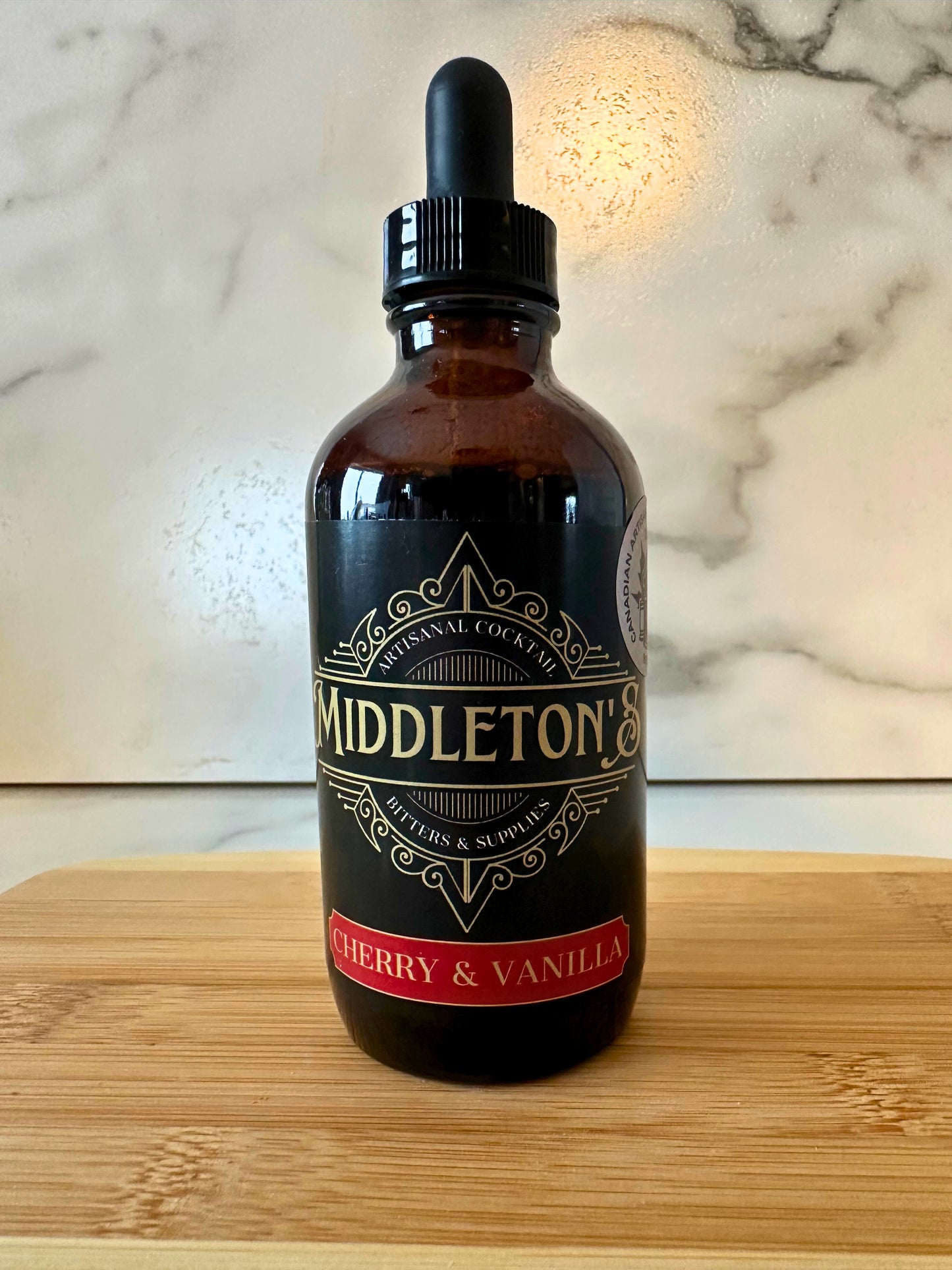 Middleton's Cherry & Vanilla Bitters 4oz bottle with rich amber liquid and handcrafted label